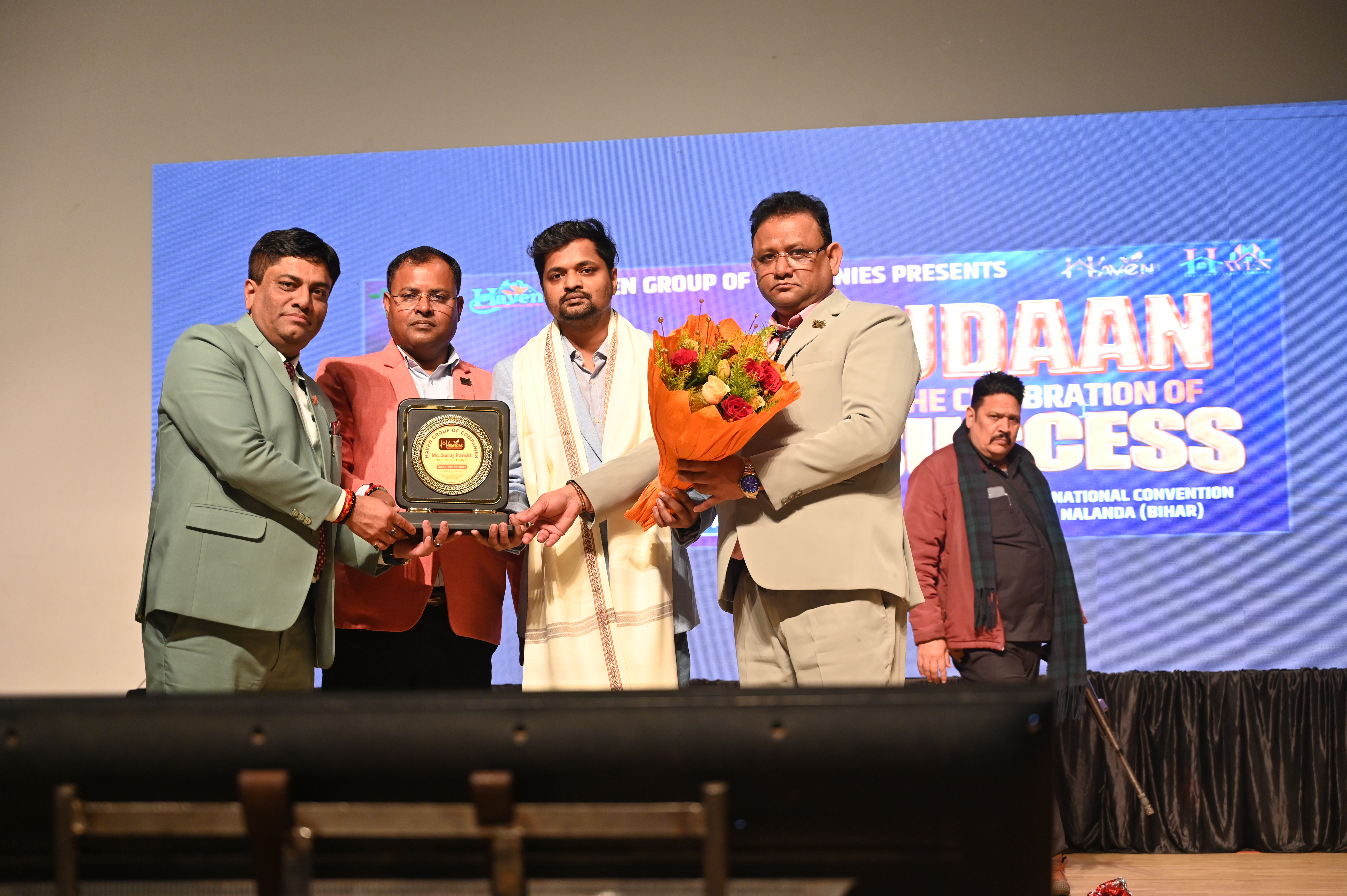 Givni CEO Suraj Pandit receiving award at international conference